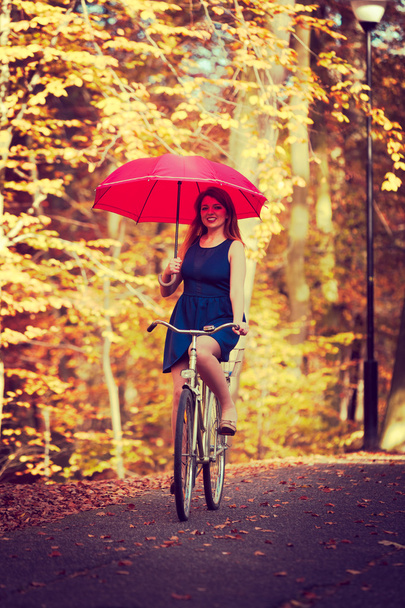 Elegant girl cycling. - Фото, зображення