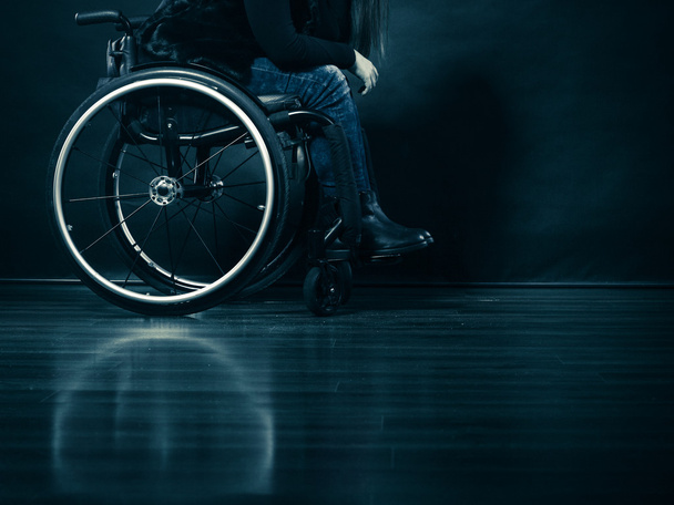 Woman invalid girl sitting on wheelchair - Фото, изображение
