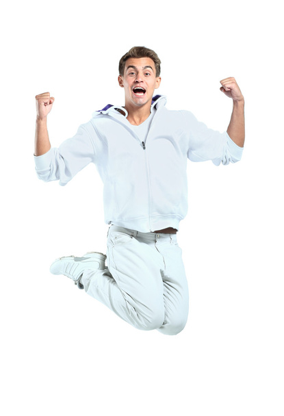 Jumping young man. Isolated over white background - Foto, imagen