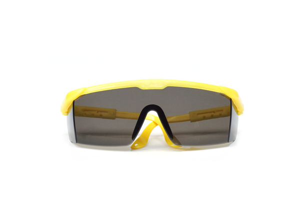 Óculos de proteção na cor amarela
 - Foto, Imagem