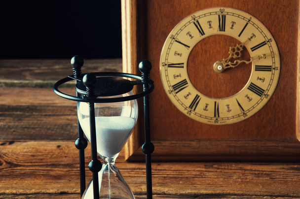 Hourglass and old vintage clock - Photo, Image