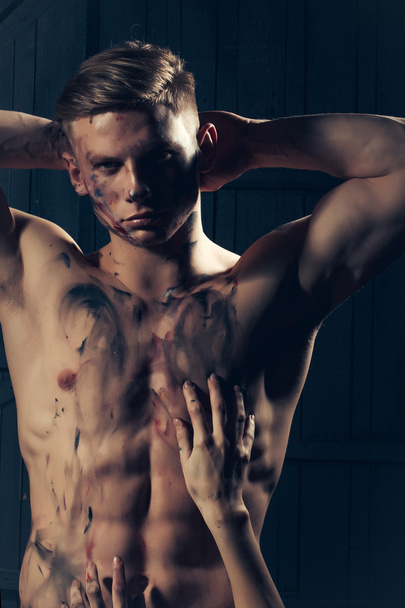 Muscular paited man and hands - Foto, imagen