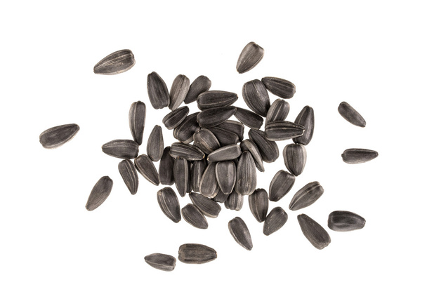 Pile of black sunflower seeds isolated on white background - Photo, Image