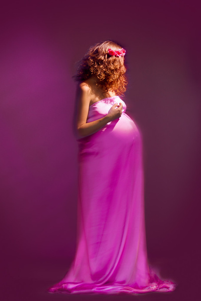 Pregnant girl with flying dress - 写真・画像