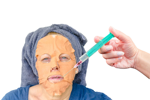 Máscara facial cosmética e uma injeção de botulino
      - Foto, Imagem