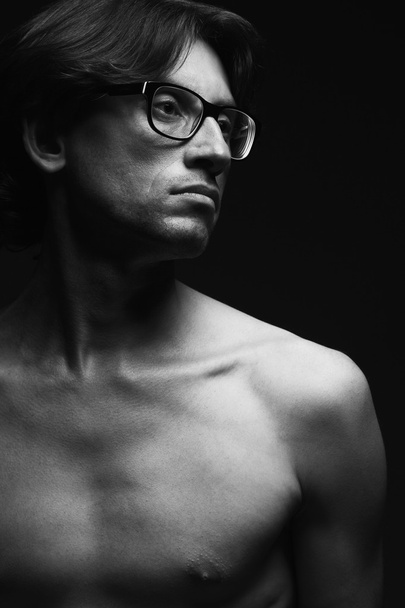 Eyewear concept. Profile portrait of charismatic mature man wearing glasses - Fotó, kép