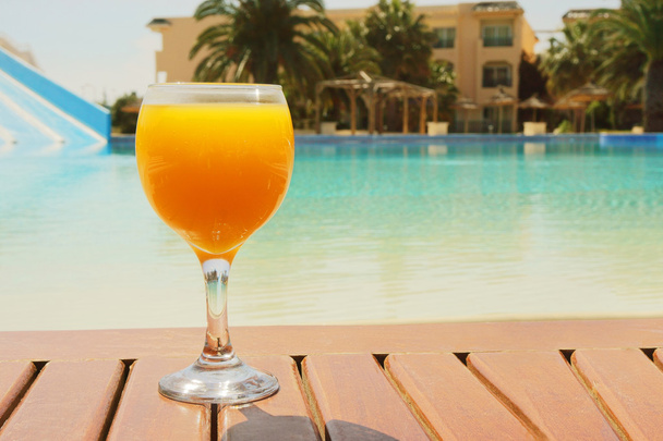 orange juice on a pool background - Zdjęcie, obraz