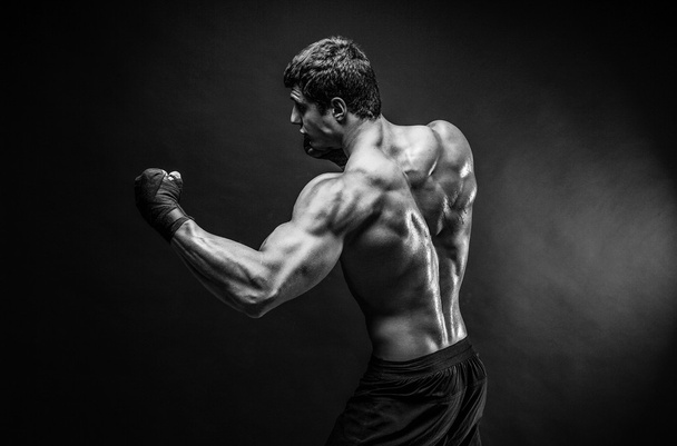 Handsome topless sportsman practicing punches - Fotografie, Obrázek