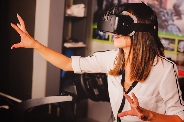 Woman playing game in virtual reality glasses - Photo, image