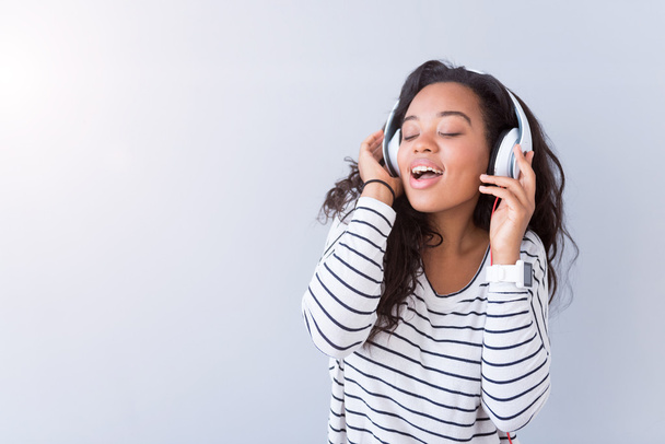 Joyful content woman listening to music - Фото, зображення
