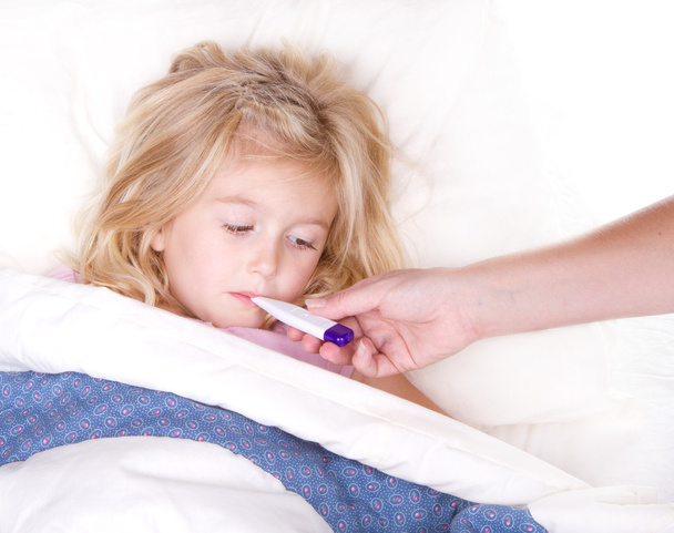Sick childl with a thermometer in mouth - Foto, Bild
