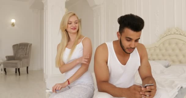 pregnancy test positive result, couple sitting bed mix race man woman happy smile embrace morning bedroom - Metraje, vídeo