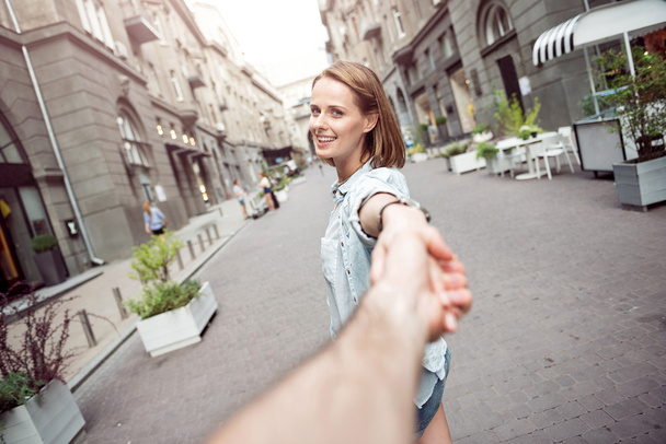 Cheerful woman having a walk with her boyfriend - Zdjęcie, obraz
