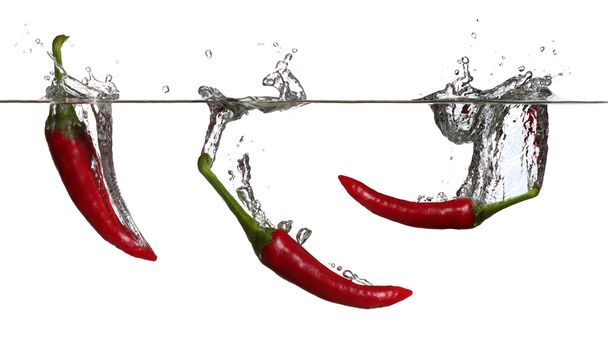 Concept of red pepper in water - Φωτογραφία, εικόνα