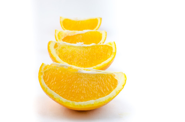 Slices of orange on a white background. - Photo, Image