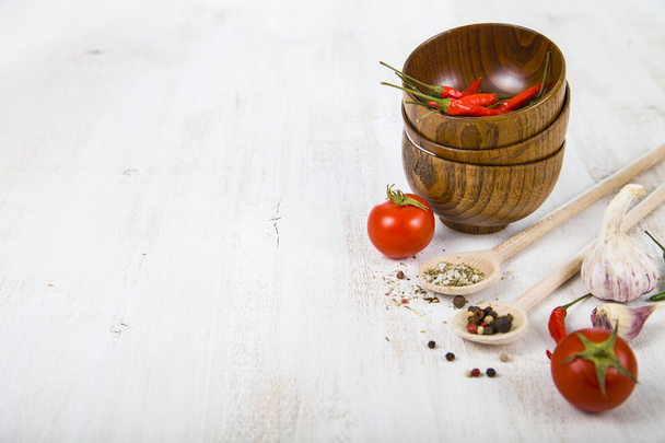 Vegetables and spices in wooden bowls  - Foto, Imagem