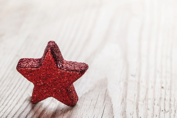 Red star on wooden background - Фото, зображення