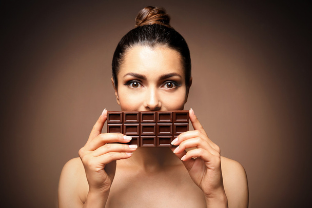 Beautiful girl with chocolate  - Fotoğraf, Görsel