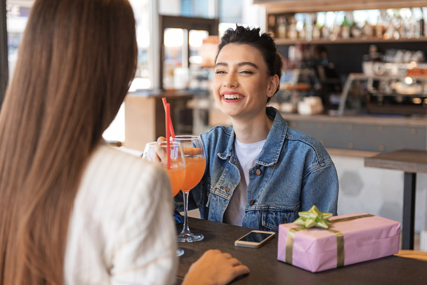 female friends talking in a cafe - Фото, изображение