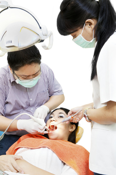 Asian dentist with assistant and patient - Foto, imagen