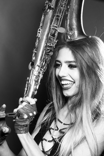 Woman with saxophone - Фото, изображение