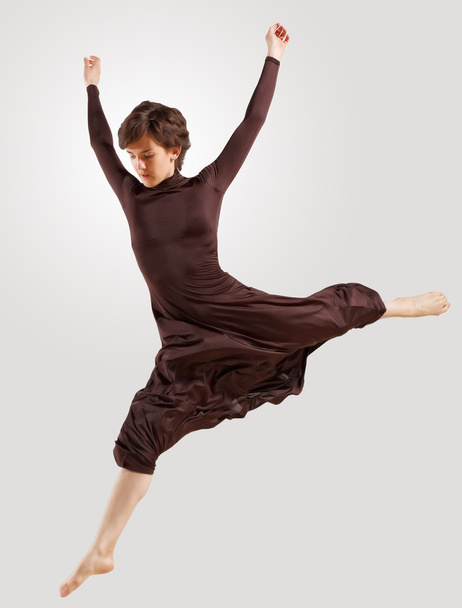 Girl in dark dress dancing - Foto, Imagen