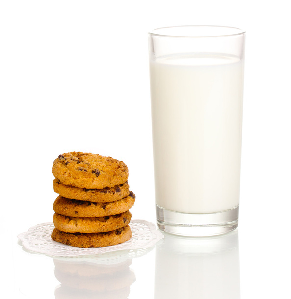Glass of milk and cookies isolated on white - Фото, изображение