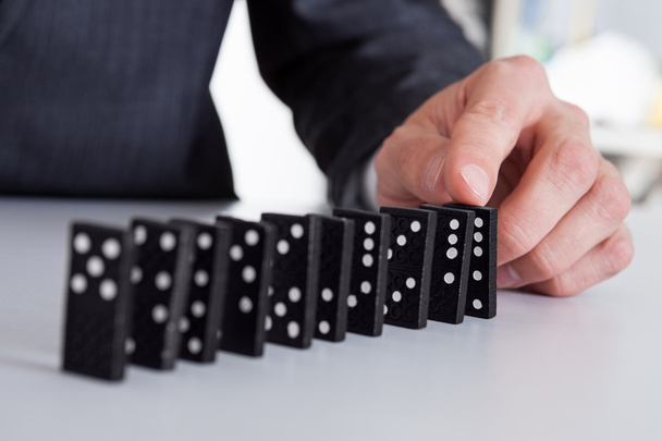 Businessman playing domino - Φωτογραφία, εικόνα