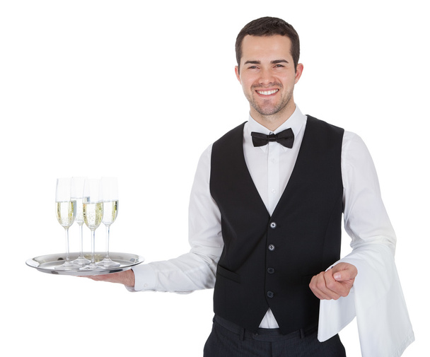 Portrait of a cheerful young butler - Photo, Image