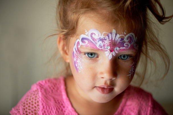 Pretty exciting blue-eyed girl of 2 years with a face painting - Zdjęcie, obraz
