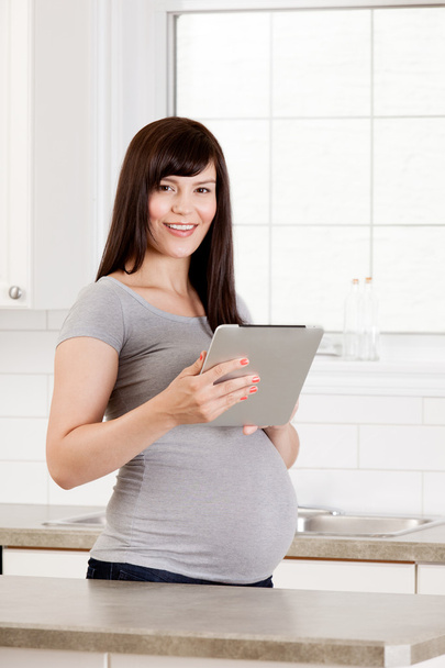 Pregnant Woman with Digital Tablet - Foto, imagen