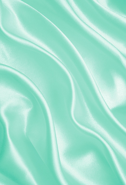 Smooth elegant green silk or satin texture as background - Foto, imagen