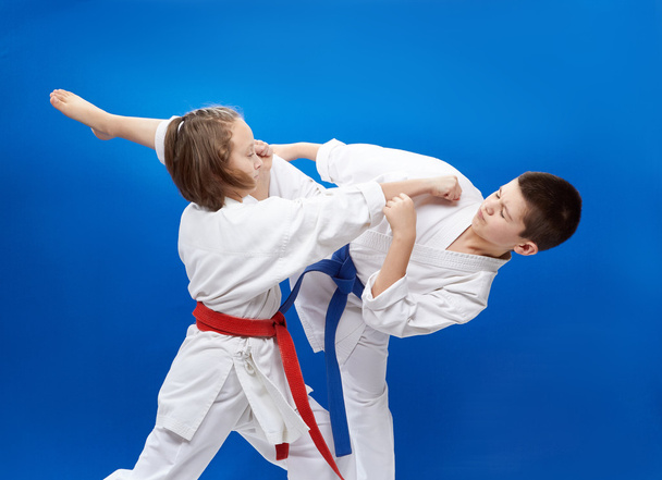 Young athletes train blocks and kicks of karate - Photo, Image