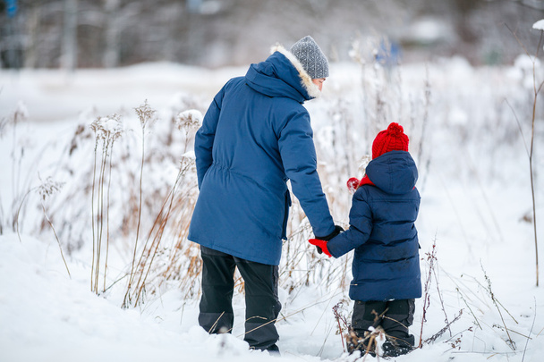 Father and daughter outdoors at winter - Photo, image