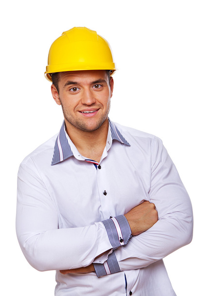 Portrait of sexy worker posing in studio in helmet - Foto, Imagen