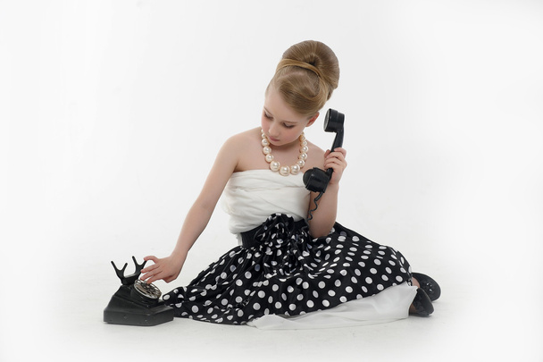 Little girl with a retro phone - Fotoğraf, Görsel
