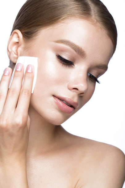 Beautiful young girl with wipes for removing makeup and French manicure. Beauty face. - Valokuva, kuva