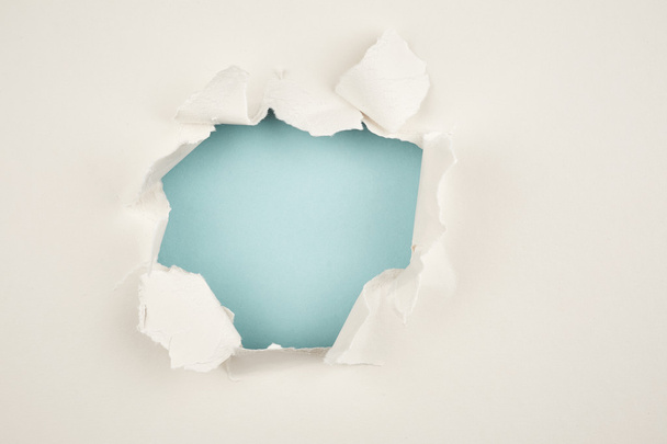 Hole in paper background - Photo, Image