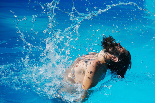 bearded man in swimming pool - Фото, изображение