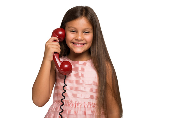 little girl talking on a vintage telephone - Foto, Imagen