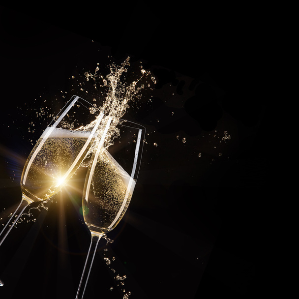 Glasses of champagne with splash. - Фото, изображение