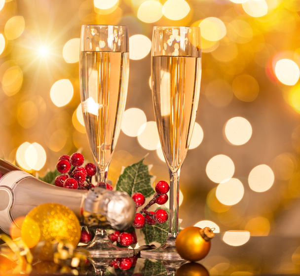 Glasses of champagne with blurred gold bokeh. - Foto, Imagen
