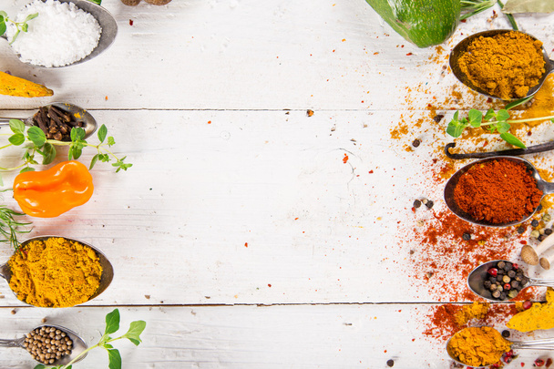 Various colorful spices on wooden table - Foto, immagini