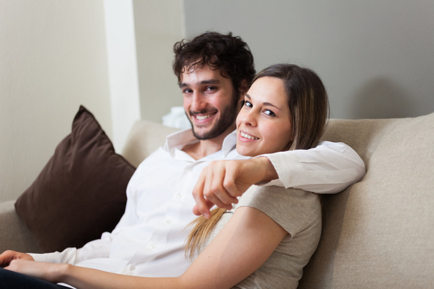 Couple sitting on a couch - Photo, Image
