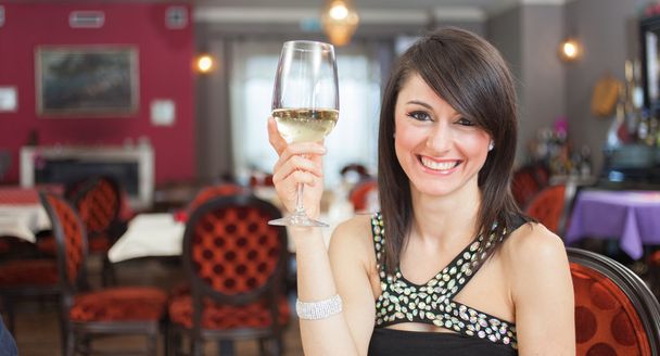 Woman holding wineglass  - Zdjęcie, obraz
