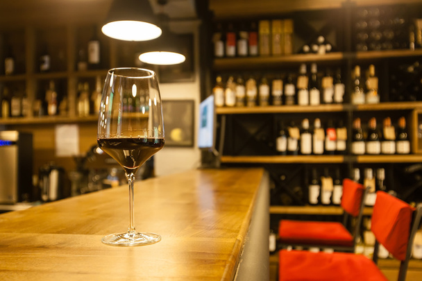 Glass of wine in a bar - Photo, Image