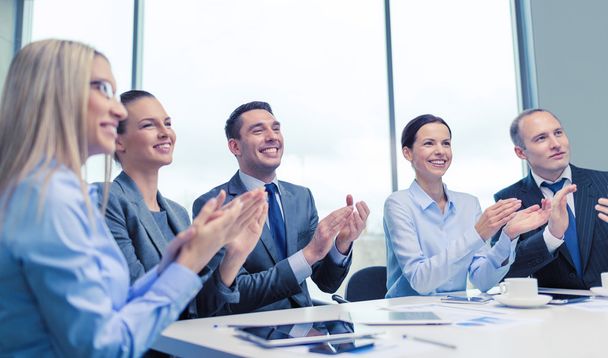 business team with laptop clapping hands - Photo, Image