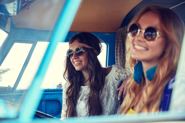 smiling young hippie women driving minivan car - Photo, Image