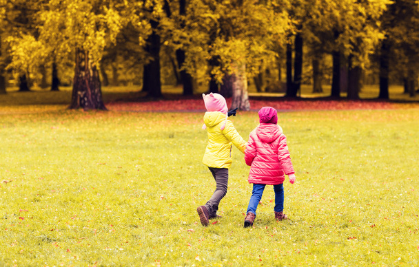 happy little girls running outdoors - Fotoğraf, Görsel