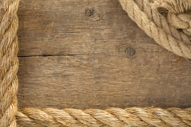Ship ropes and knot on wood background - Zdjęcie, obraz